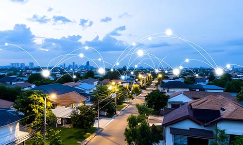 Smart city network, houses at dusk, aerial view, IoT concept city network